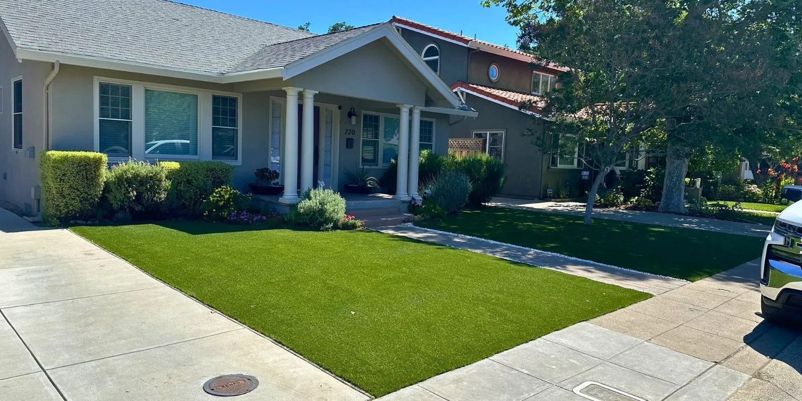 Front yard featuring lush artificial turf